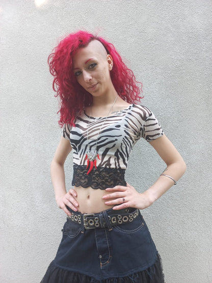 Crop top in tulle zebrato con bordo in pizzo nero