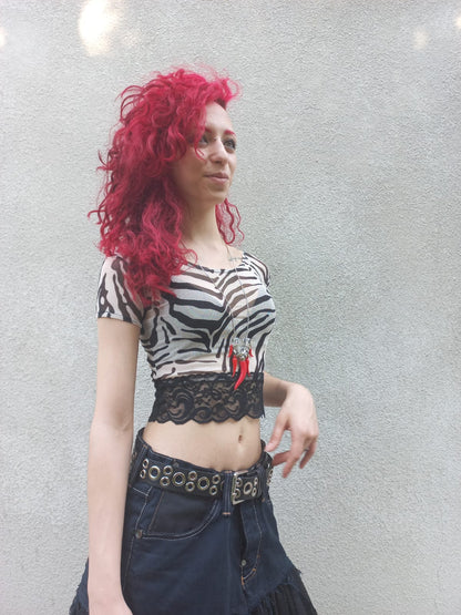 Crop top in tulle zebrato con bordo in pizzo nero